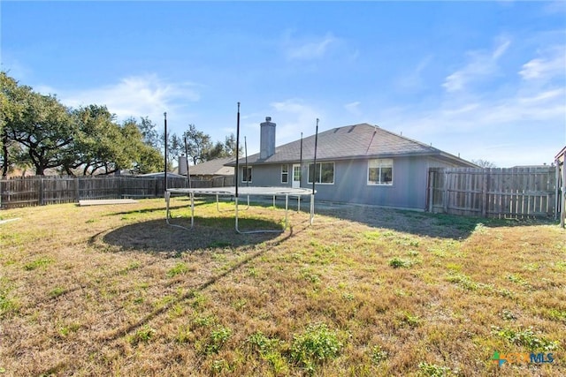 5105 Parkwood Dr, Killeen, TX 76542 - view of yard with a fenced backyard and a trampoline