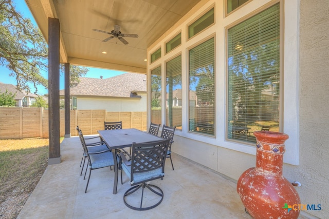 view of patio featuring ceiling fan