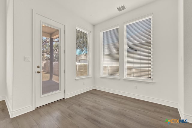 interior space with hardwood / wood-style flooring