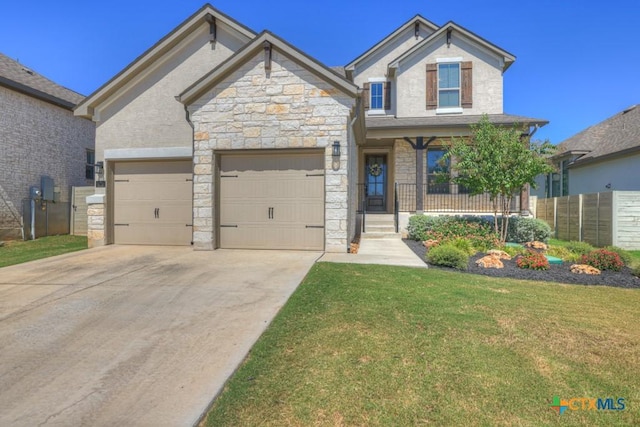 craftsman-style house featuring a garage, stone siding, a front lawn, and driveway