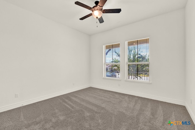 carpeted empty room featuring ceiling fan