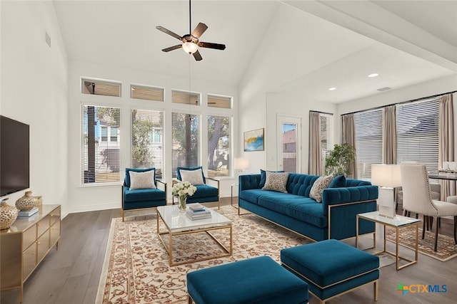 living room featuring ceiling fan, wood-type flooring, and high vaulted ceiling