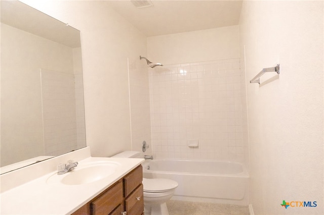 full bathroom with toilet, tiled shower / bath combo, vanity, and tile patterned flooring