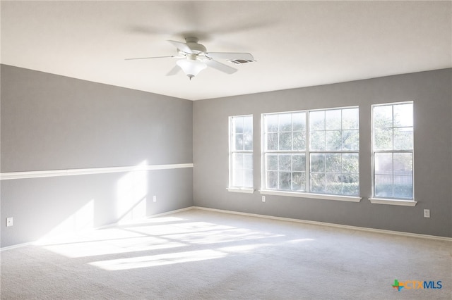 unfurnished room with light carpet and ceiling fan