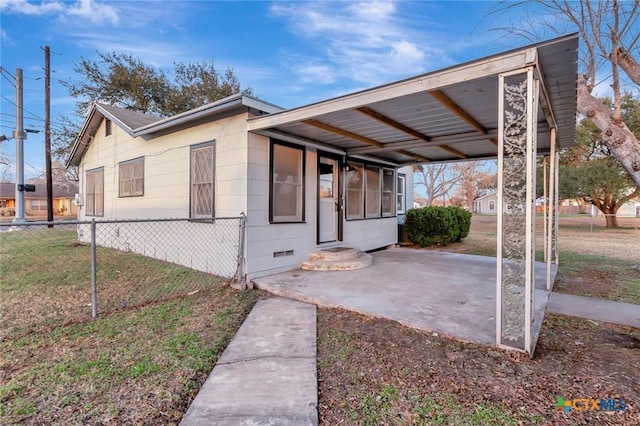 view of front of home featuring a carport