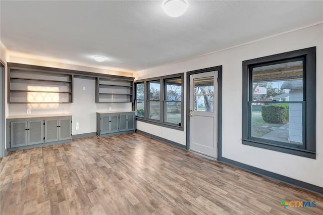 unfurnished living room with hardwood / wood-style floors