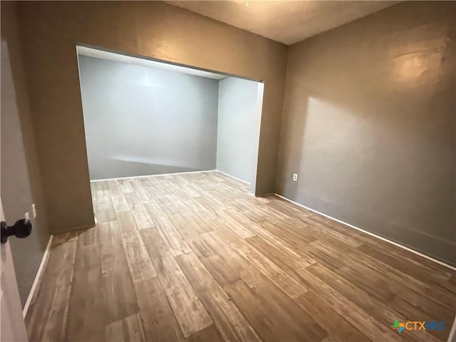 348 N Burke St, Goliad, TX 77963 - spare room with wood finished floors