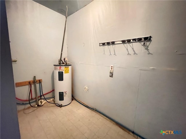 348 N Burke St, Goliad, TX 77963 - utility room with electric water heater