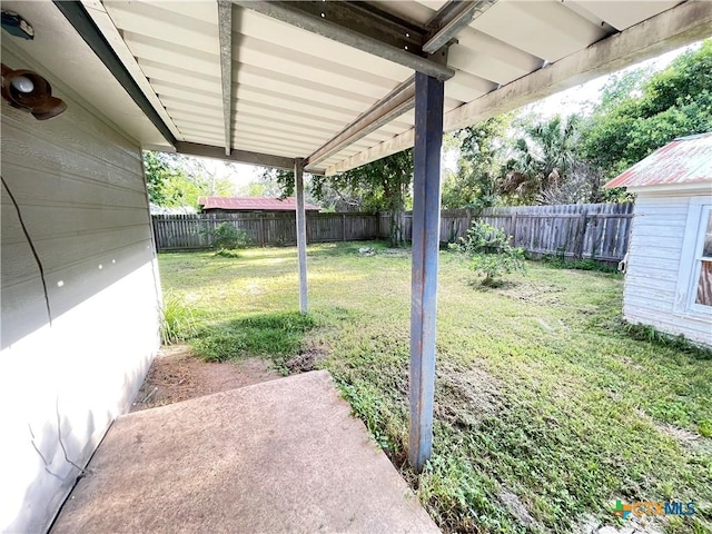 348 N Burke St, Goliad, TX 77963 - view of yard featuring a patio and a fenced backyard