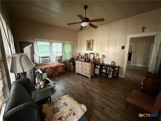 202 S Virginia St, Port Lavaca, TX 77979 - living area featuring dark wood-type flooring, ceiling fan, and cooling unit
