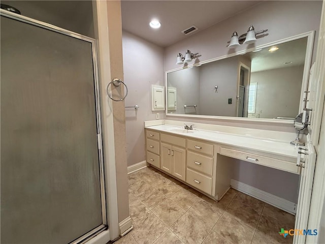 202 S Virginia St, Port Lavaca, TX 77979 - bathroom featuring a shower stall, vanity, and tile patterned flooring