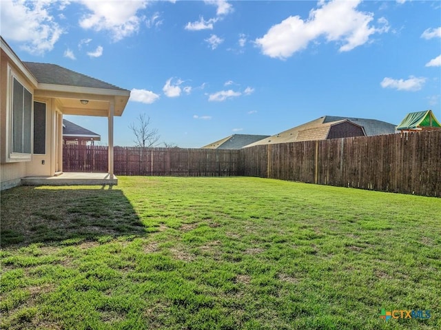 view of yard featuring a patio and a fenced backyard