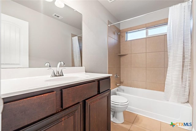 full bathroom featuring vanity, visible vents, shower / bath combo, tile patterned floors, and toilet