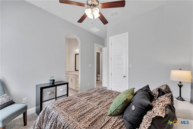 bedroom featuring ensuite bathroom and ceiling fan