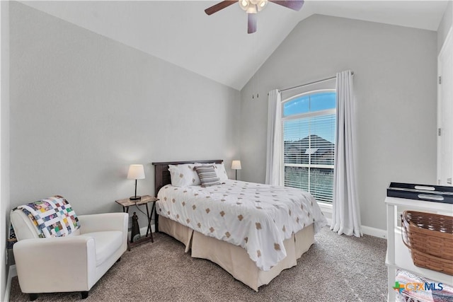 carpeted bedroom with ceiling fan and vaulted ceiling