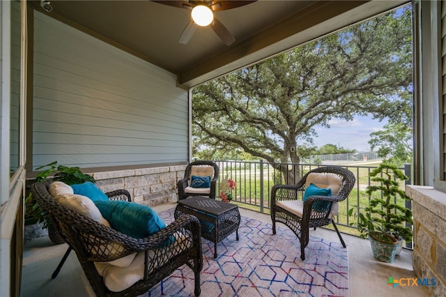 balcony featuring ceiling fan