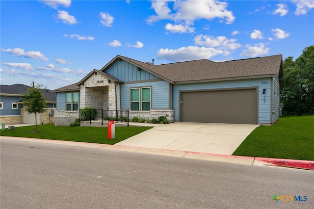 view of front facade featuring a garage and a front yard