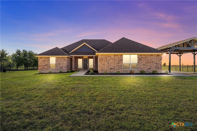 single story home featuring a patio, a yard, and a gazebo