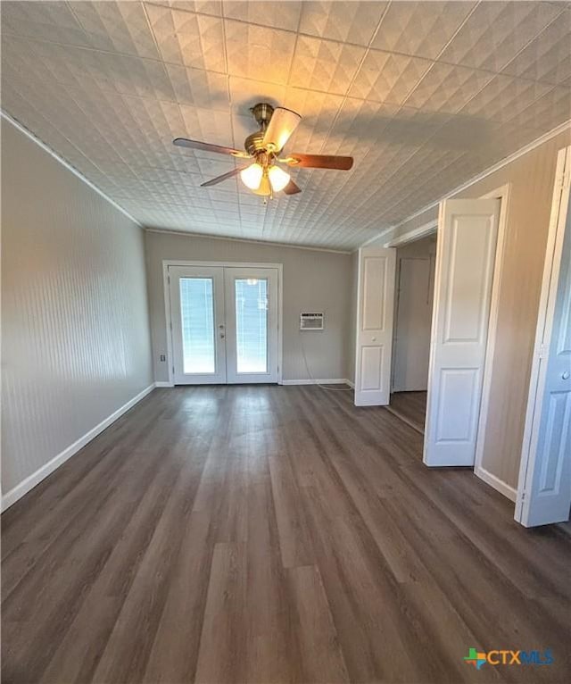 interior space featuring a wall mounted AC, french doors, dark hardwood / wood-style floors, and ceiling fan