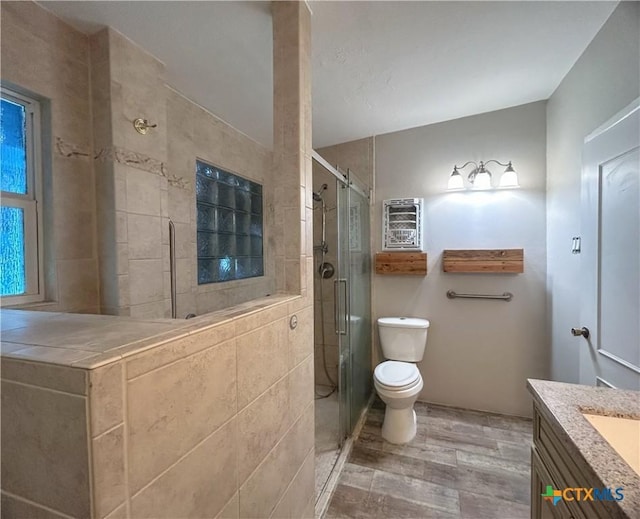 3101 Bobolink Ln, Victoria, TX 77901 - full bath with wood finished floors, vanity, and a stall shower