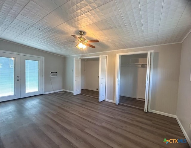 unfurnished bedroom with ceiling fan, dark hardwood / wood-style flooring, ornamental molding, and french doors