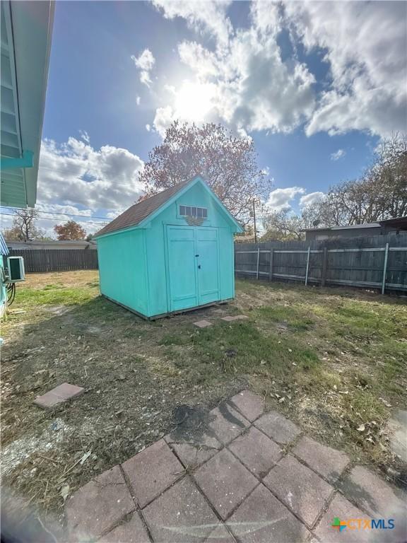 view of outbuilding with a lawn