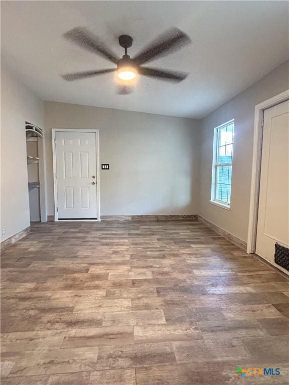 3101 Bobolink Ln, Victoria, TX 77901 - unfurnished bedroom featuring wood finished floors and ceiling fan
