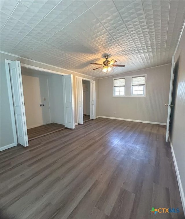 unfurnished bedroom with dark hardwood / wood-style floors, ceiling fan, and ornamental molding