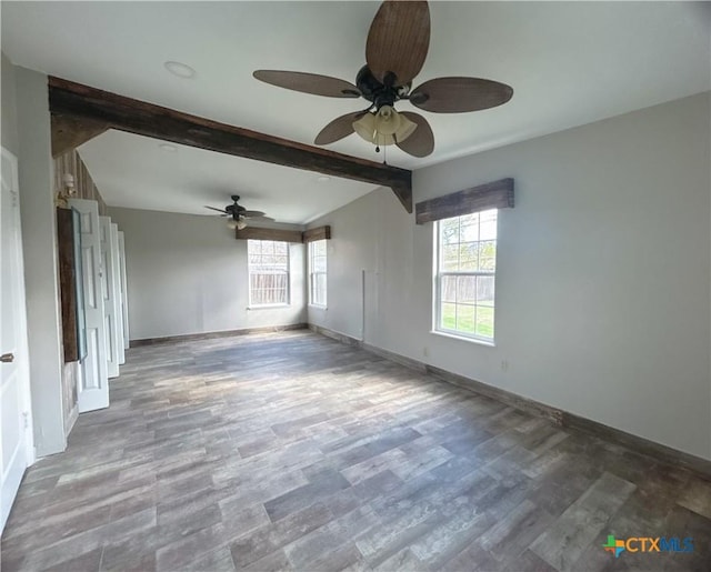 unfurnished room featuring ceiling fan, beamed ceiling, and wood-type flooring