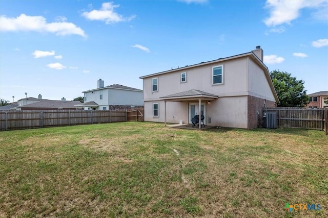 4203 Rambling Range Dr, Killeen, TX 76549 - back of house featuring a chimney, a fenced backyard, and a patio
