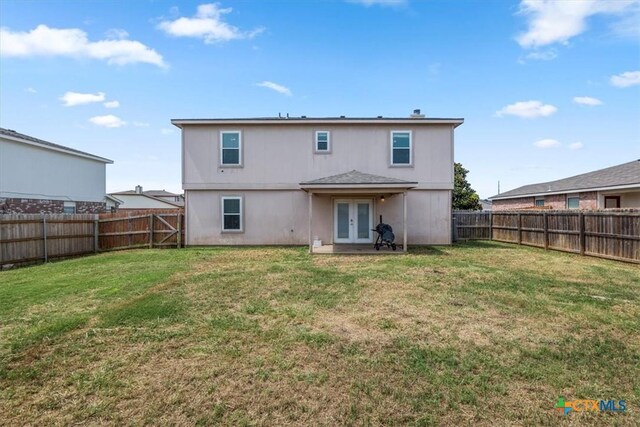 4203 Rambling Range Dr, Killeen, TX 76549 - rear view of property with french doors and a fenced backyard