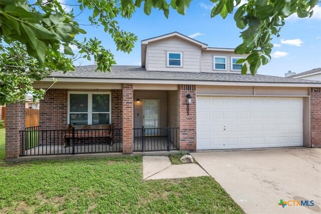 4203 Rambling Range Dr, Killeen, TX 76549 - traditional-style house with brick siding, concrete driveway, and roof with shingles