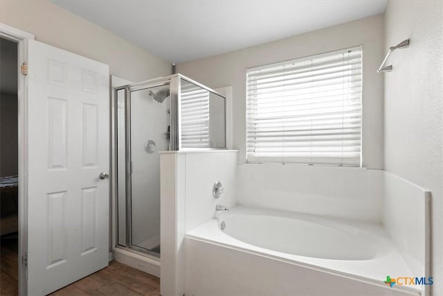 4203 Rambling Range Dr, Killeen, TX 76549 - bathroom with a stall shower, a bath, and wood finished floors