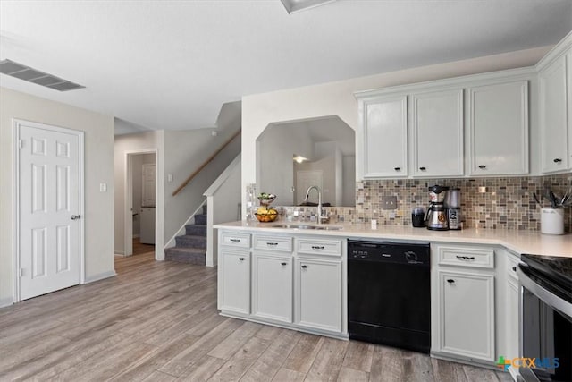 4203 Rambling Range Dr, Killeen, TX 76549 - kitchen with black appliances, tasteful backsplash, light countertops, and light wood-style floors