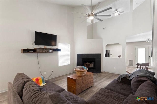 4203 Rambling Range Dr, Killeen, TX 76549 - living room featuring high vaulted ceiling, a ceiling fan, wood finished floors, and a tile fireplace