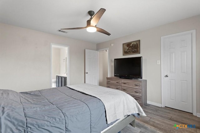 4203 Rambling Range Dr, Killeen, TX 76549 - bedroom featuring wood finished floors, a ceiling fan, and ensuite bathroom
