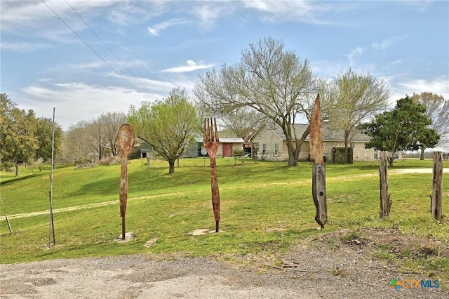 view of home's community featuring a yard