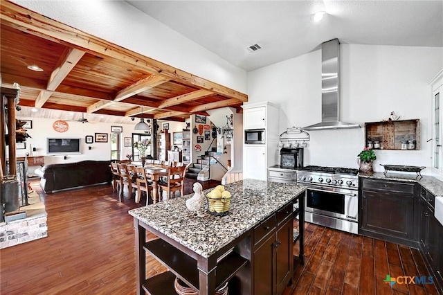 kitchen featuring dark wood-type flooring, open shelves, stainless steel appliances, wall chimney exhaust hood, and light stone countertops