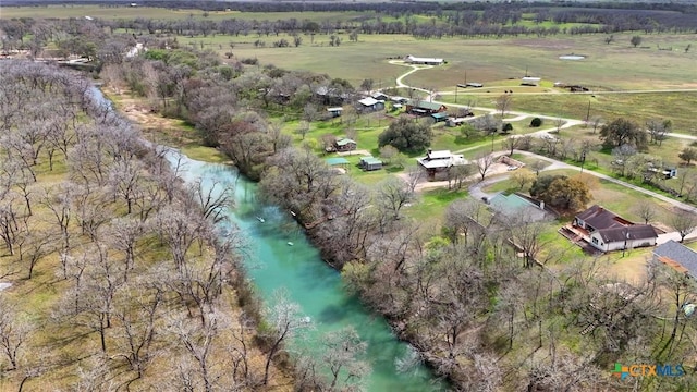 birds eye view of property with a rural view and a water view