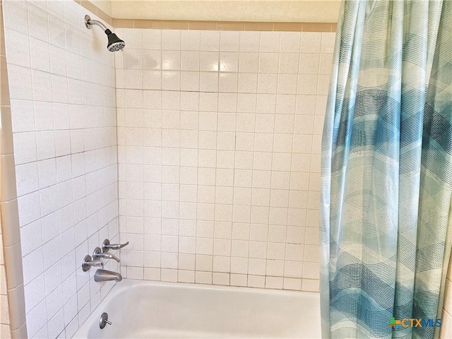 bathroom with shower / bathtub combination with curtain