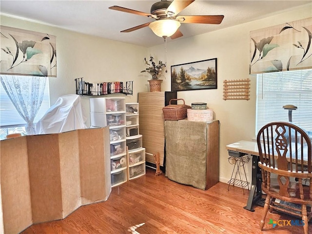 interior space featuring hardwood / wood-style floors and ceiling fan