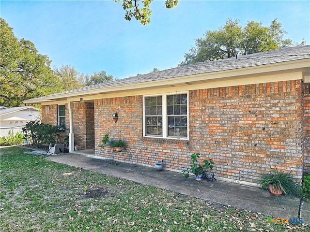 rear view of property with a patio area and a yard