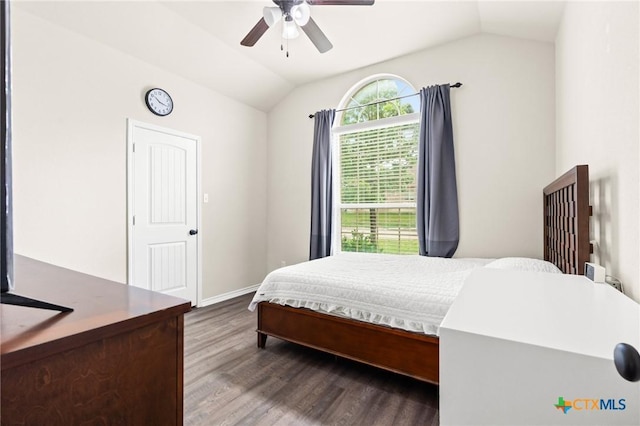 bedroom featuring baseboards, a ceiling fan, wood finished floors, and lofted ceiling