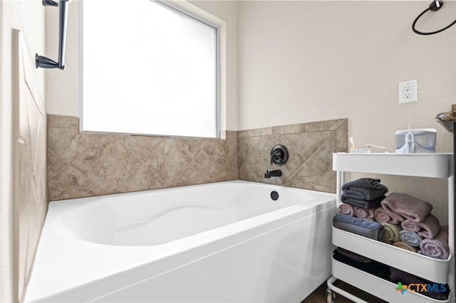full bath with a garden tub