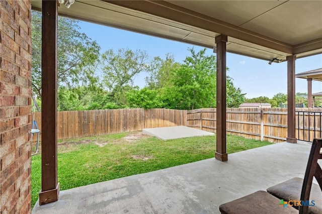 view of yard with a fenced backyard and a patio