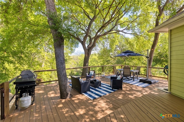 wooden terrace with area for grilling and outdoor dining area