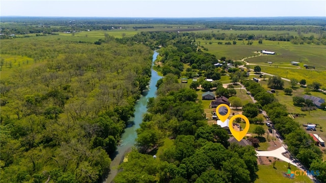 aerial view with a rural view and a water view