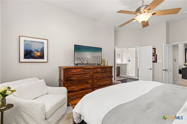 bedroom with connected bathroom and a ceiling fan