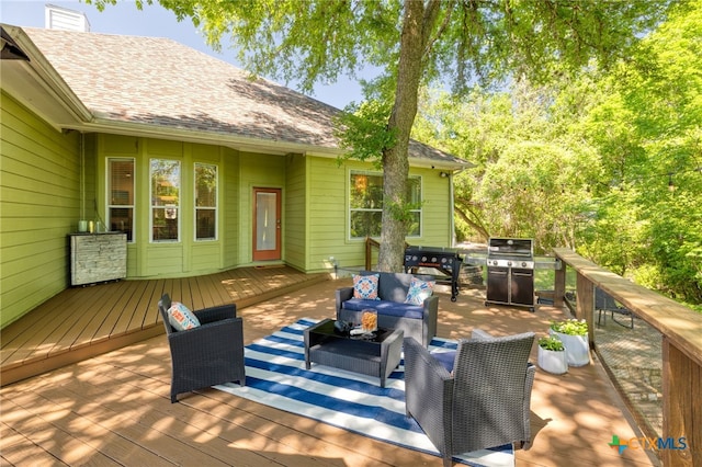 wooden deck with area for grilling and outdoor lounge area