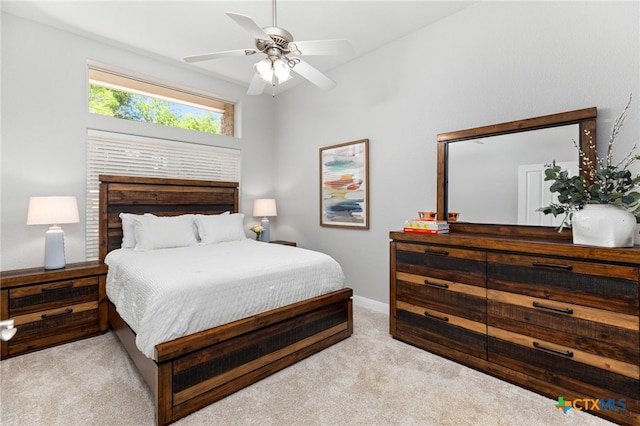 carpeted bedroom featuring ceiling fan and baseboards
